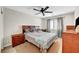 The bedroom showcases cozy decor, a ceiling fan, and natural light from the window at 8633 Radiant Ruby Ave, Las Vegas, NV 89143