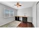 Bedroom featuring built in work space next to the window and a ceiling fan at 8633 Radiant Ruby Ave, Las Vegas, NV 89143