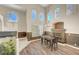 Bright dining area featuring a cozy fireplace, contemporary chandelier, and stylish decor at 8633 Radiant Ruby Ave, Las Vegas, NV 89143