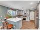 Modern kitchen featuring sleek gray cabinets, stainless steel appliances, and a functional layout at 8633 Radiant Ruby Ave, Las Vegas, NV 89143