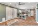 Charming kitchen with grey cabinets, stainless appliances, a breakfast bar, and backyard access at 8633 Radiant Ruby Ave, Las Vegas, NV 89143
