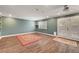 Large living room with tile floors, recessed lights, and French doors leading to the backyard at 8633 Radiant Ruby Ave, Las Vegas, NV 89143