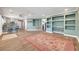 Open living area featuring tile floors, an open floor plan, and stylish light fixtures at 8633 Radiant Ruby Ave, Las Vegas, NV 89143