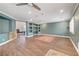 Spacious living room featuring tile floors, built-in shelving, recessed lighting, and neutral paint at 8633 Radiant Ruby Ave, Las Vegas, NV 89143