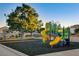 A colorful community playground featuring slides, swings, and climbing structures for enjoyment at 8633 Radiant Ruby Ave, Las Vegas, NV 89143