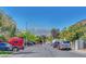 A lovely street view with parked cars and mountain views in the distance at 8633 Radiant Ruby Ave, Las Vegas, NV 89143