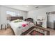 Sunlit bedroom with a queen bed, modern furniture, and a cozy ambiance at 8729 Country View Ave, Las Vegas, NV 89129