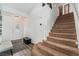 Welcoming entryway with a carpeted staircase, hardwood floors, and a stylish front door at 8729 Country View Ave, Las Vegas, NV 89129