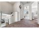 Upstairs hallway overlooking the kitchen, featuring carpeted floors and access to additional bedrooms at 8729 Country View Ave, Las Vegas, NV 89129