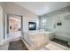 Modern bathroom with a standalone shower and a built-in tub at 9611 Trattoria St, Las Vegas, NV 89178