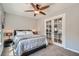 Bedroom featuring a plush bed and a glass door leading to another room at 9611 Trattoria St, Las Vegas, NV 89178
