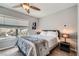 Comfortable bedroom with plush bedding, neutral tones, and natural light at 9611 Trattoria St, Las Vegas, NV 89178