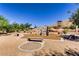 Outdoor climbing wall and playground area with benches and views of the surrounding desert landscape at 9611 Trattoria St, Las Vegas, NV 89178