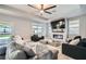 Comfortable living room with a modern fireplace, large TV, and a spacious sectional sofa at 9611 Trattoria St, Las Vegas, NV 89178