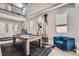 Bright living area with a pool table, high ceilings, statement art, and ample natural light at 9611 Trattoria St, Las Vegas, NV 89178