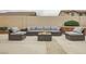 Inviting outdoor patio area with comfortable seating, a cozy fire pit, and a serene ambiance at 9611 Trattoria St, Las Vegas, NV 89178