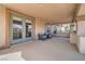 Spacious covered patio with outdoor seating, perfect for relaxing or entertaining at 9611 Trattoria St, Las Vegas, NV 89178