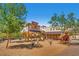 Charming western themed playground featuring slides, spring riders, and a horse drawn carriage at 9611 Trattoria St, Las Vegas, NV 89178