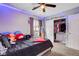 Bright bedroom featuring a closet, plush pillows and a view from the window at 9992 Oyster Pearl St, Las Vegas, NV 89183
