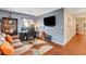 Large bedroom features hardwood floors, a desk, and a mounted television at 9992 Oyster Pearl St, Las Vegas, NV 89183