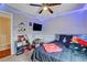 Well-lit bedroom with decorative shelves, modern lighting and a view to the upstairs hall at 9992 Oyster Pearl St, Las Vegas, NV 89183