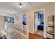 Upstairs hallway with hardwood floors and views into secondary bedrooms at 9992 Oyster Pearl St, Las Vegas, NV 89183