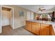 Kitchen with breakfast bar and view into the dining room at 9992 Oyster Pearl St, Las Vegas, NV 89183