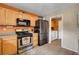Efficient kitchen with stainless appliances, light wood cabinetry, and convenient access to the laundry room at 9992 Oyster Pearl St, Las Vegas, NV 89183