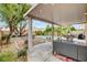 Inviting patio with view of the pool, seating, and lush backyard at 9992 Oyster Pearl St, Las Vegas, NV 89183
