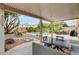 Relaxing covered patio with outdoor seating and backyard swimming pool, perfect for entertaining at 9992 Oyster Pearl St, Las Vegas, NV 89183