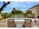 Inviting backyard pool area with lounge chairs, perfect for enjoying sunny days and outdoor relaxation at 9992 Oyster Pearl St, Las Vegas, NV 89183