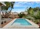 Clean pool surrounded by mature landscaping, a relaxing retreat in a peaceful backyard at 9992 Oyster Pearl St, Las Vegas, NV 89183