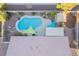 Aerial view of a backyard pool, landscaping, and shaded pergola structures at 10058 Saint Augustine St, Las Vegas, NV 89183