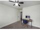 Bedroom with ceiling fan and desk with personal computer at 10058 Saint Augustine St, Las Vegas, NV 89183