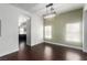 Dining area with hardwood floors, modern lighting, and ample natural light from dual windows at 10058 Saint Augustine St, Las Vegas, NV 89183