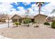 Charming single story home features a terracotta tile roof, desert landscaping and a two-car garage at 10058 Saint Augustine St, Las Vegas, NV 89183