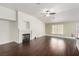 Bright living room featuring a white tiled fireplace and hardwood floors at 10058 Saint Augustine St, Las Vegas, NV 89183