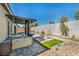 Relaxing backyard features an outdoor kitchen, seating area, pool and tasteful landscaping at 10062 Mountain Foothills Ave, Las Vegas, NV 89149