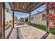Spacious backyard patio with pergola, pavers, and artificial turf offers a cozy outdoor living space at 10062 Mountain Foothills Ave, Las Vegas, NV 89149