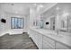 Luxurious bathroom with a soaking tub, double sinks, and modern design elements for a relaxing experience at 10062 Mountain Foothills Ave, Las Vegas, NV 89149