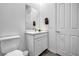 Neat powder room features a modern vanity, framed mirror, and neutral paint scheme at 10062 Mountain Foothills Ave, Las Vegas, NV 89149