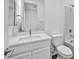 Clean, white bathroom featuring a single sink vanity, a toilet, and a tiled shower/tub combination at 10062 Mountain Foothills Ave, Las Vegas, NV 89149