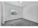 This bedroom has neutral walls, soft carpet, and a bright window at 10062 Mountain Foothills Ave, Las Vegas, NV 89149