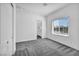 A light, airy bedroom with large window and closet at 10062 Mountain Foothills Ave, Las Vegas, NV 89149