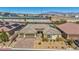 Inviting single-story home with a two-car garage and manicured desert landscape at 10062 Mountain Foothills Ave, Las Vegas, NV 89149