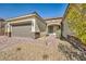 Quaint front entrance showcasing a brick walkway, well-kept landscaping, and an inviting front door at 10062 Mountain Foothills Ave, Las Vegas, NV 89149