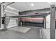 Spacious garage features a car lift, updated epoxy flooring and ample room for storage at 10062 Mountain Foothills Ave, Las Vegas, NV 89149