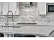Bright kitchen features white cabinets, granite countertops, and stainless steel appliances at 10062 Mountain Foothills Ave, Las Vegas, NV 89149