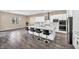 Well-lit kitchen with granite countertops, marble backsplash, and a large island with barstool seating at 10062 Mountain Foothills Ave, Las Vegas, NV 89149