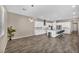 Open-concept kitchen with an eat-in island, stainless appliances, and white cabinets offering ample storage space at 10062 Mountain Foothills Ave, Las Vegas, NV 89149